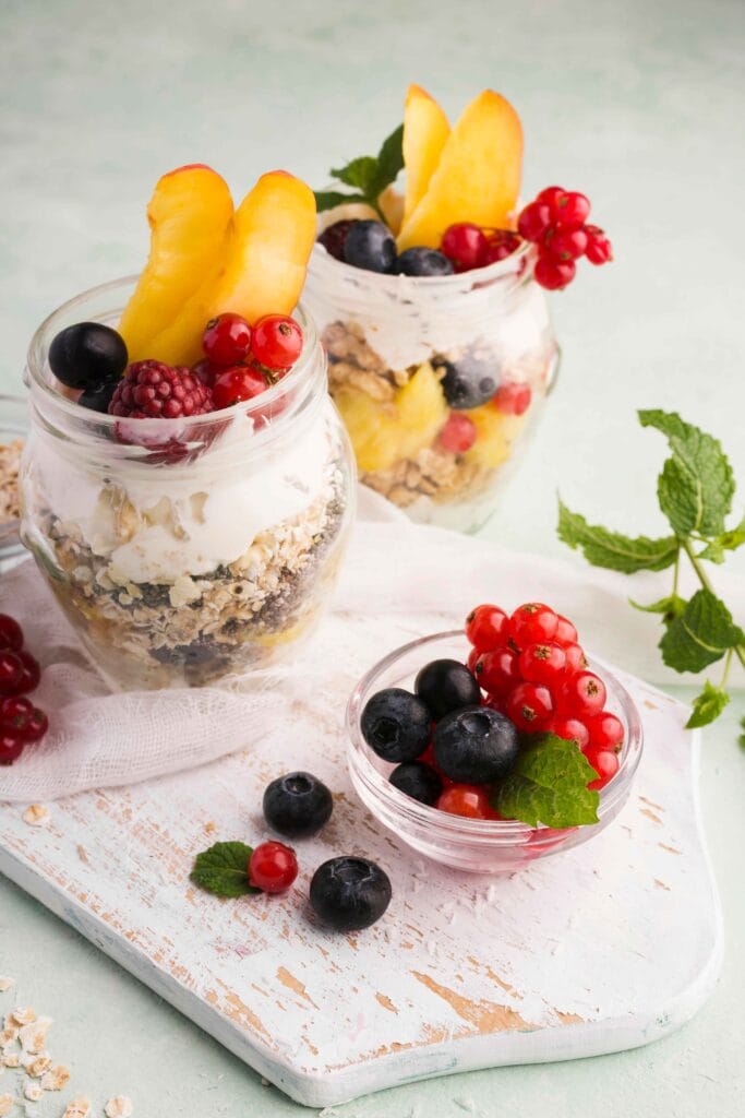 A parfait made with cottage cheese, granola, and fresh fruits.