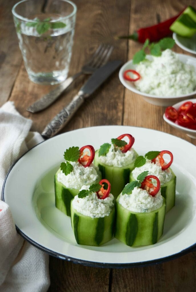 Cottage cheese paired with cucumbers, cherry tomatoes, and fresh herbs.