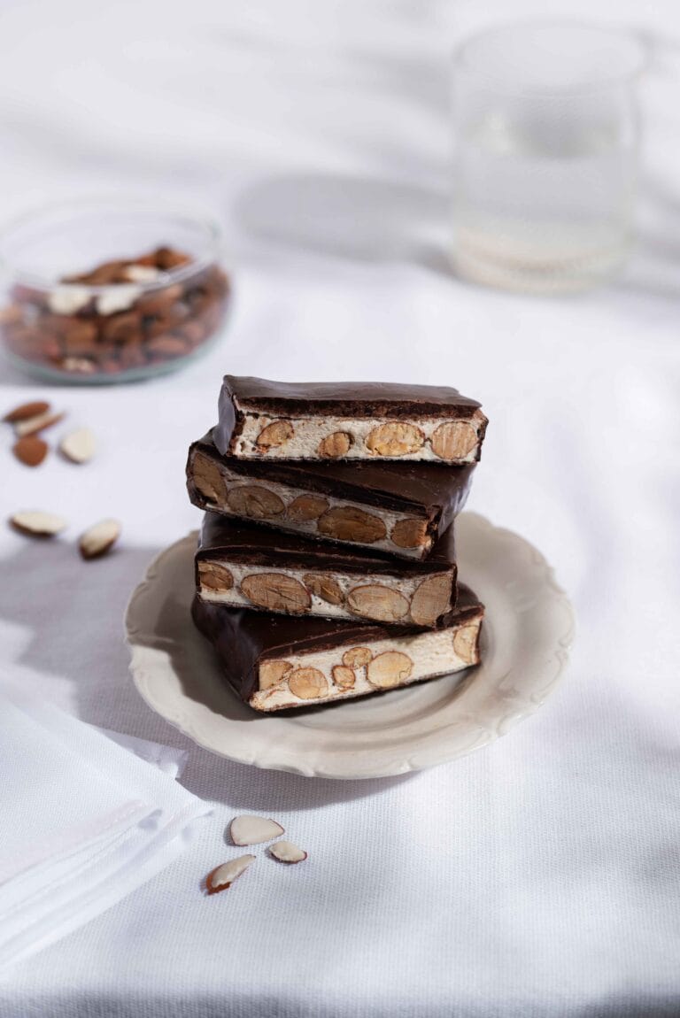 A classic Snickers bar unwrapped on a wooden table.