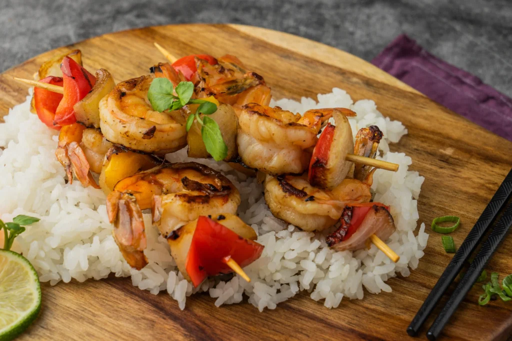 BBQ shrimp served with sides and sauces.